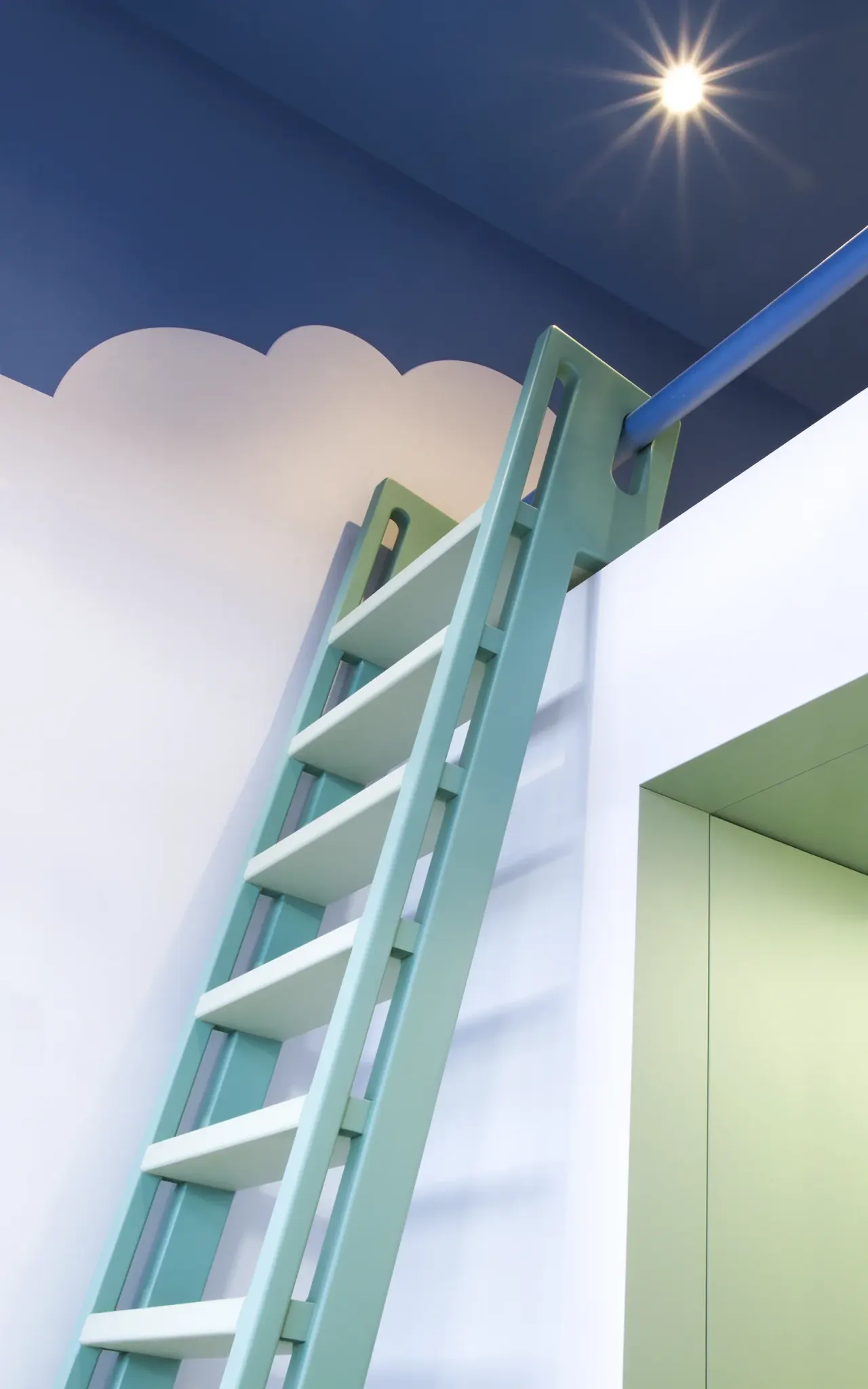 Pale green ladder leading up to a loft bed under a blue ceiling