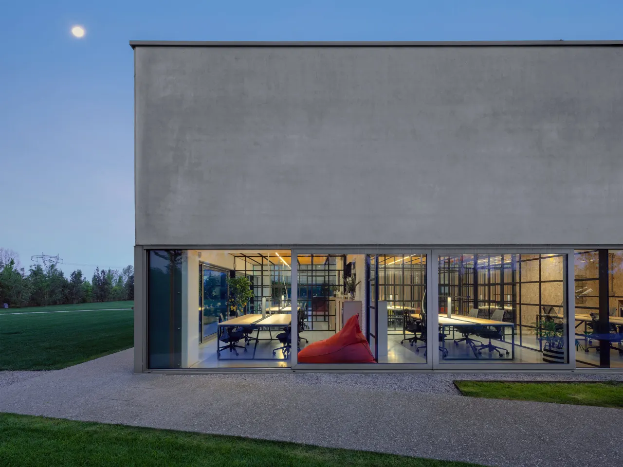 Corner of the Hangar with offices visible through the glazed facade