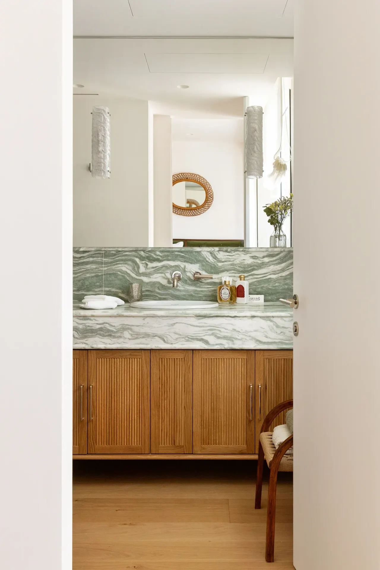 Bathroom with green marble splashback and oak vanity