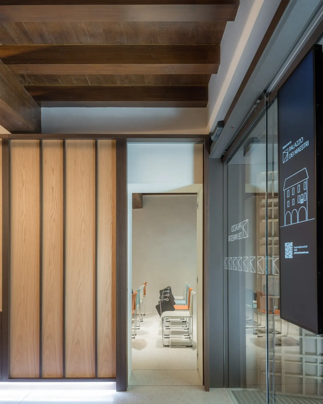 Timber sliding door and glass partition leading to a meeting room