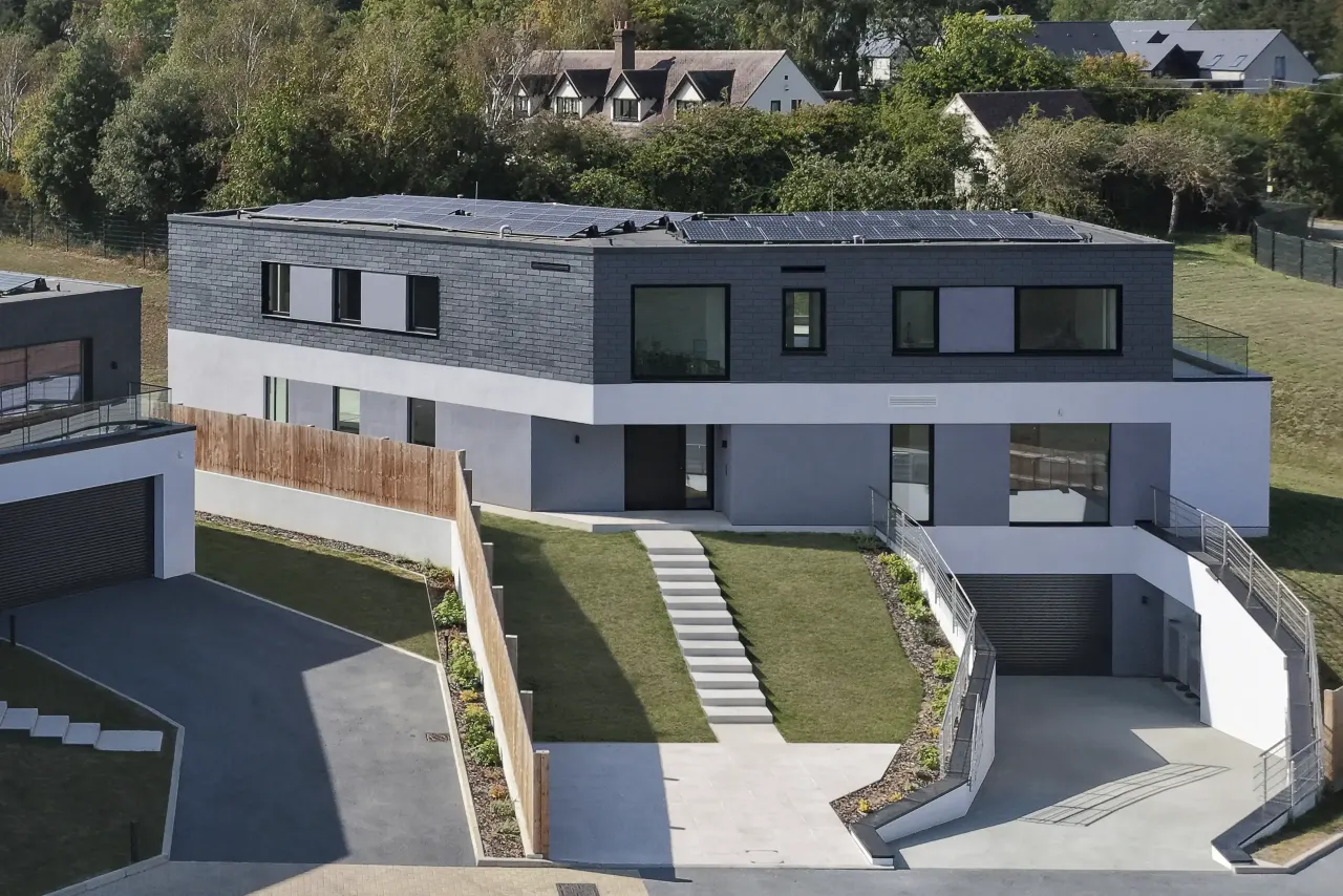 Elevated view of a house with stepped garden paths and driveway