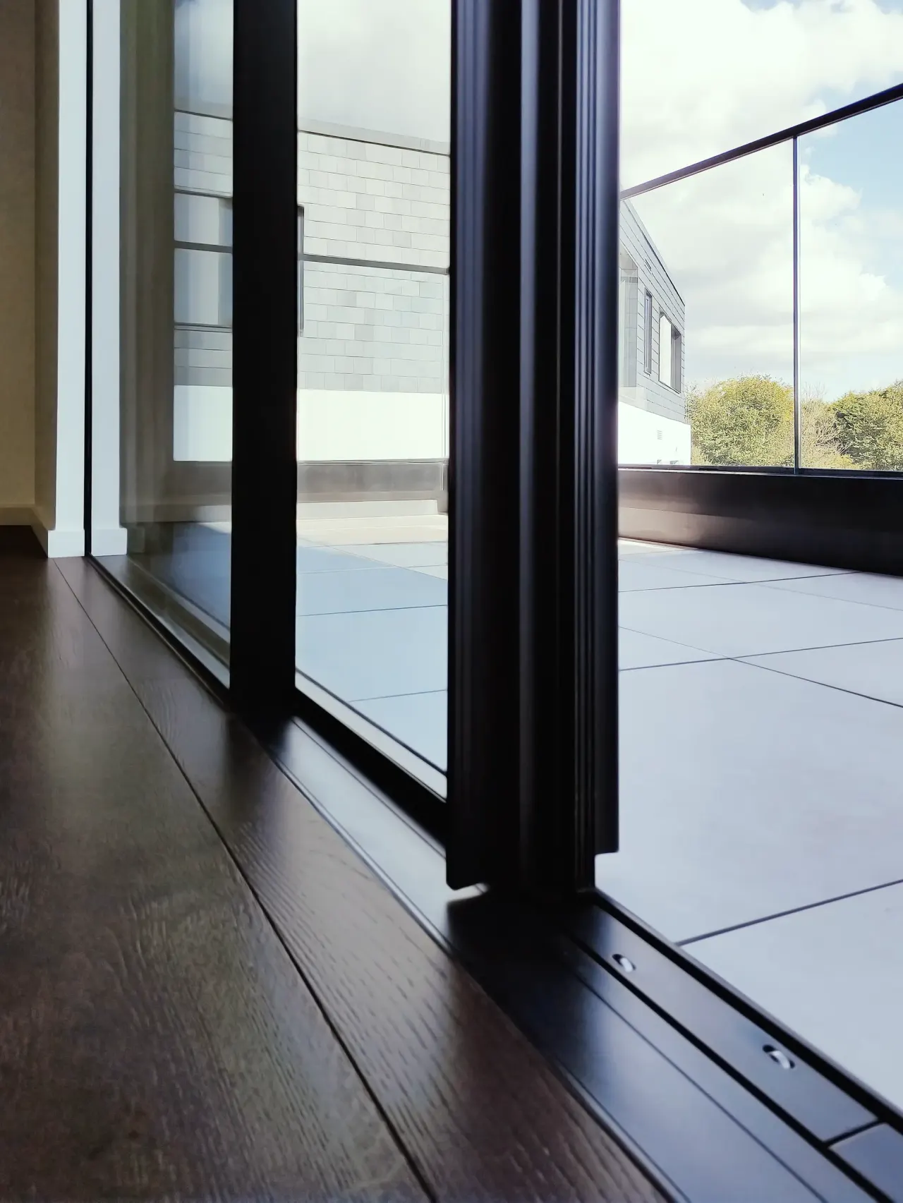 Floor-to-ceiling sliding doors opening onto the terrace